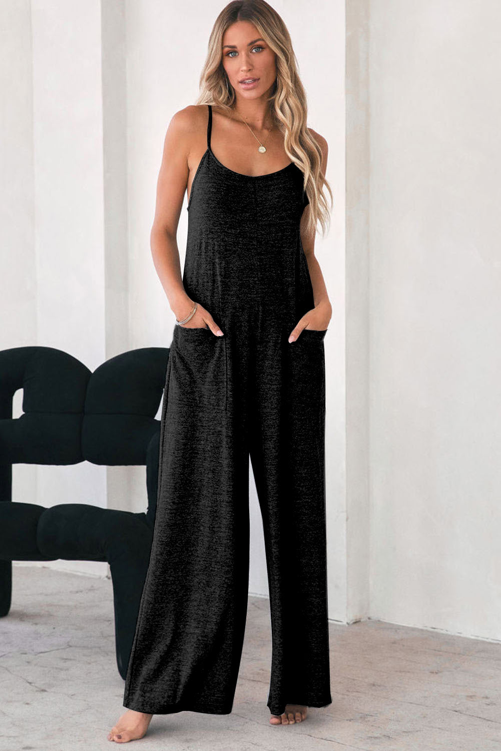 Black loose fitting, wide leg jumpsuit