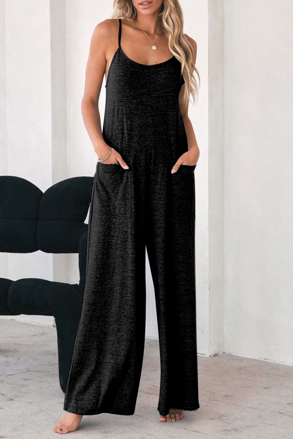 Black loose fitting, wide leg jumpsuit